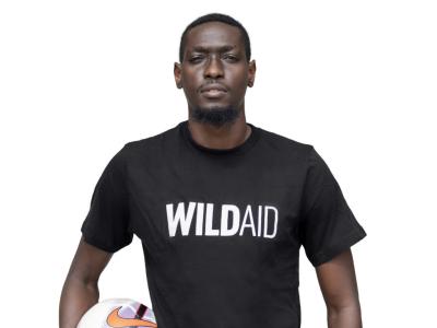 John Bocco wearing a WildAid t-shirt.